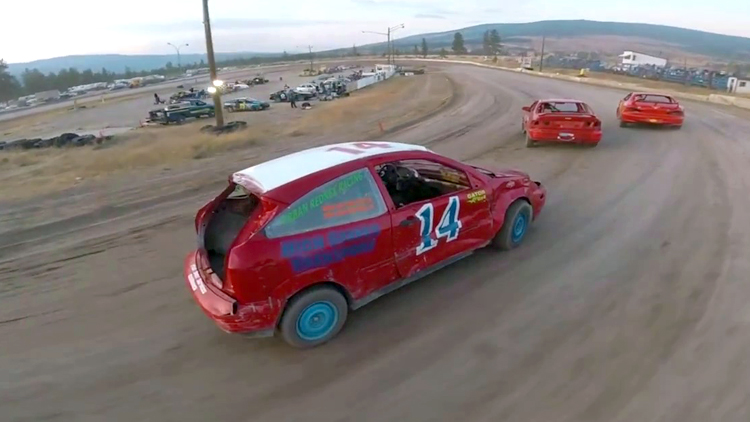 POV Footage of a High-Speed Drone Chasing After Stock Race Cars