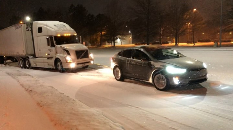 tesla-model-x-electric-suv-tows-a-stuck-