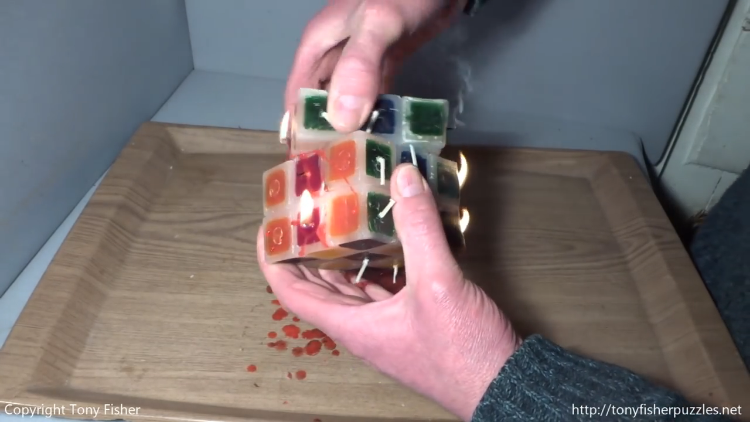 a-daring-man-solves-a-lit-rubiks-cube-ca