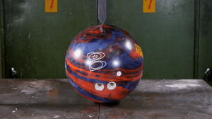 A Hydraulic Press Cuts a Bowling Ball, a Camera, and Other Random Objects in Half With a Giant Blade