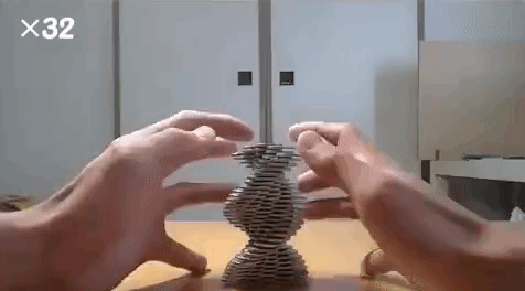 A Man With a Steady Hand Stacks Coins to Create Gravity Defying Sculptures