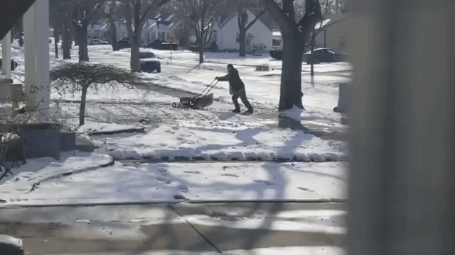 Michigan Man Tries to Mow His Lawn That Is Covered in Snow
