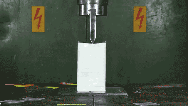 A Hydraulic Press Gloriously Cuts 10 Decks of Playing Cards in Half With a Giant Blade
