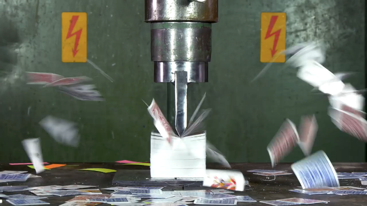 A Hydraulic Press Gloriously Cuts 10 Decks of Playing Cards in Half With a Giant Blade