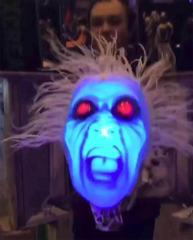 A Terrifying Screaming Ghost Head Lunges Out of a Special Effects Box at Victims