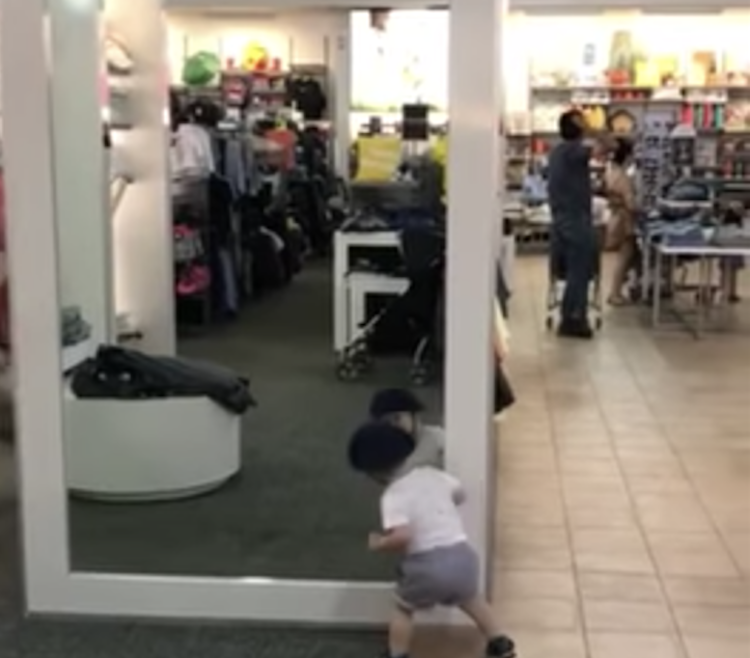 Toddler Looking for Toddler in Mirror