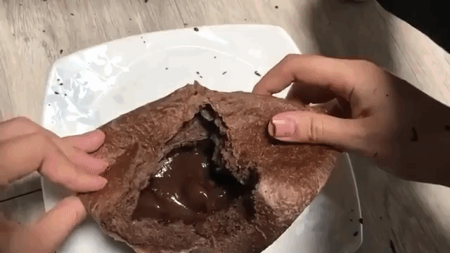 Cat Steps in Creamy Chocolate Filling of Cake