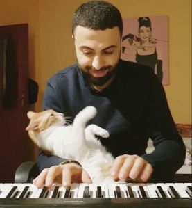 Affectionate Rescued Cat at Piano With Human Lullabye