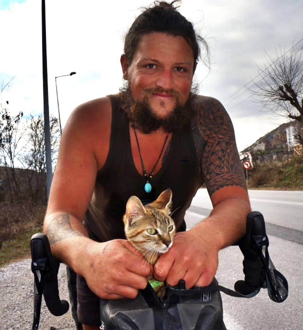 Man on Bicycle Adopts Kitten