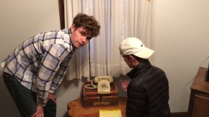 Teens Try to Dial Rotary Phone