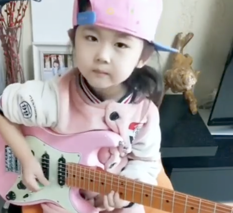 Little-Girl-in-Pink-Hat-Shreds-Guitar-So