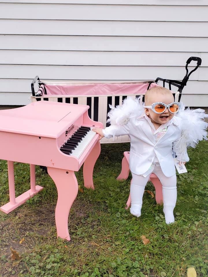 Baby Elton John with Pink Piano
