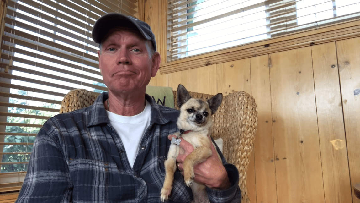Paul Rugg Pets His Dog