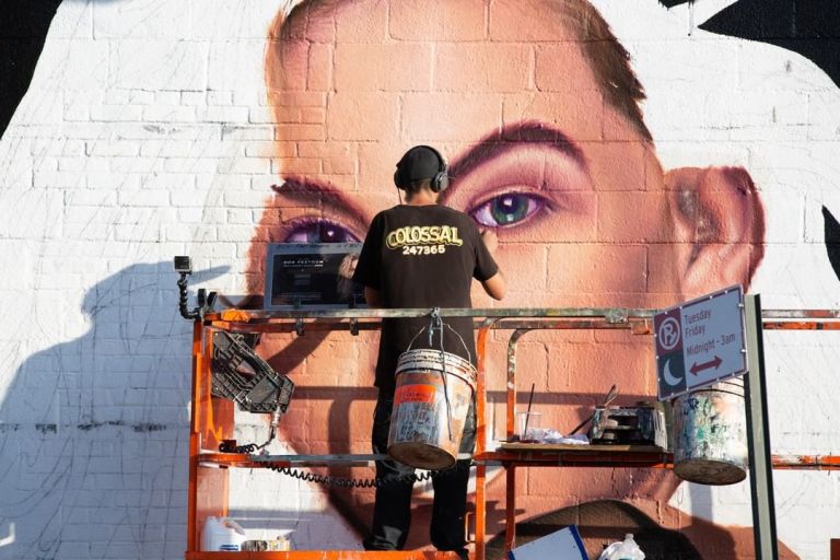 Colossal Media Sign Painting