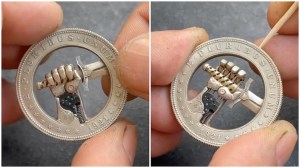 Mechanical Sword Grasping Hand Inside Coin