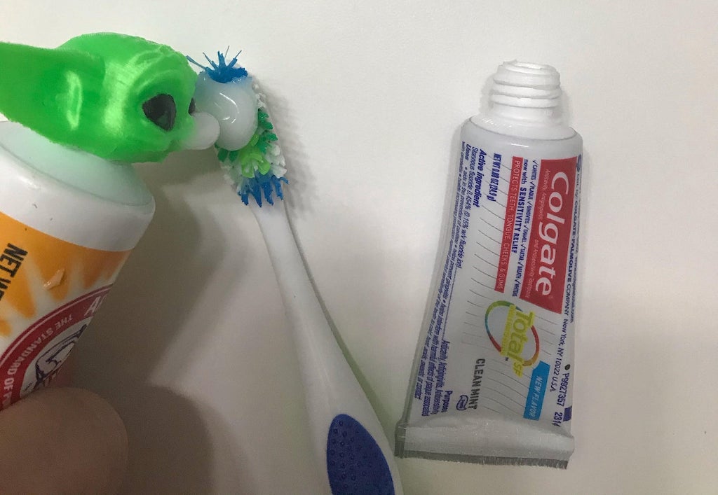 An Adorable 3D Printed Baby Yoda Toothpaste Tube Topper That Vomits