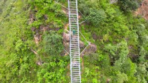 Climbing Steep Mountain Ladder in Sichuan
