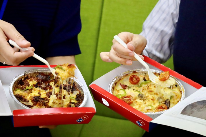 Two Domino Pizza Rice Bowls