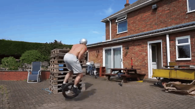 Unicycle Jump Onto 10 Pallets