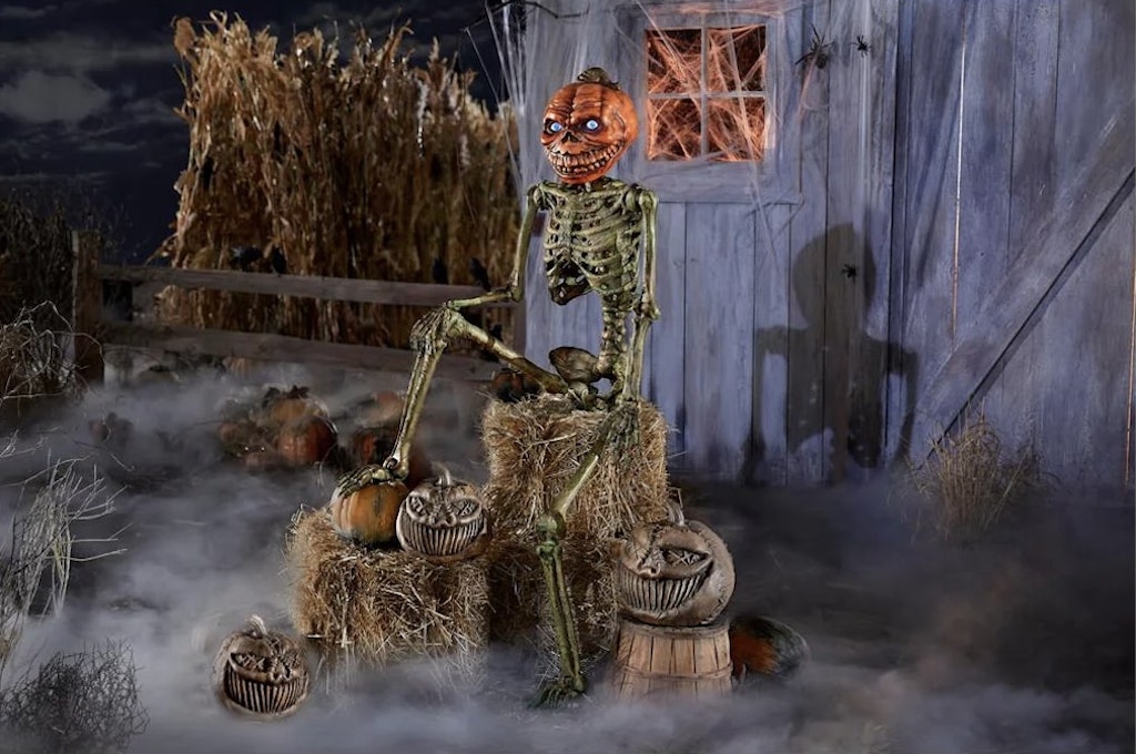 A Terrifying Giant 12 Foot Pumpkin Head Skeleton With a Fiery Chest and