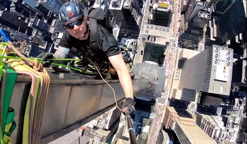 Master Rigger Carries Out Maintenance on Top of Chrysler Building