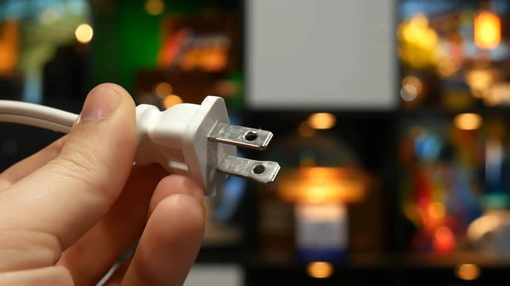 Why the Prongs on US Electrical Plugs Have Holes