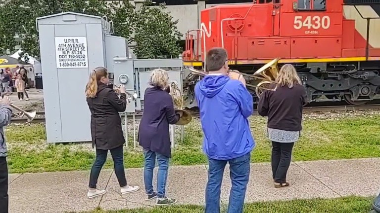 Brass Band Talks to Passing Train