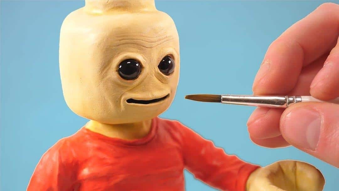 A Realistic LEGO Man Carved Out of Clay