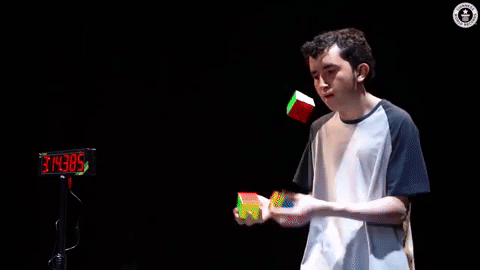 Solving 3 Rubiks Cubes While Juggling