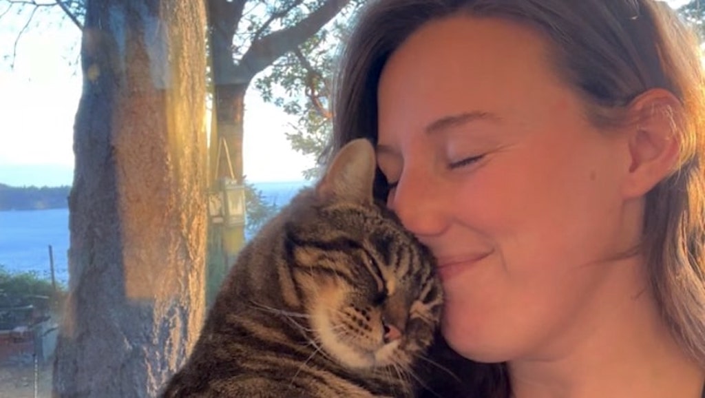 Senior Cat Hugs Her Adoptive Human at First Meeting