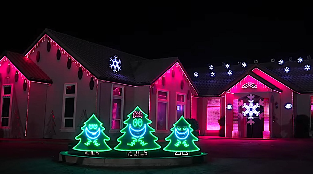 Three Smiling Christmas Trees Sing Modern Carols in a Fantastic Holiday