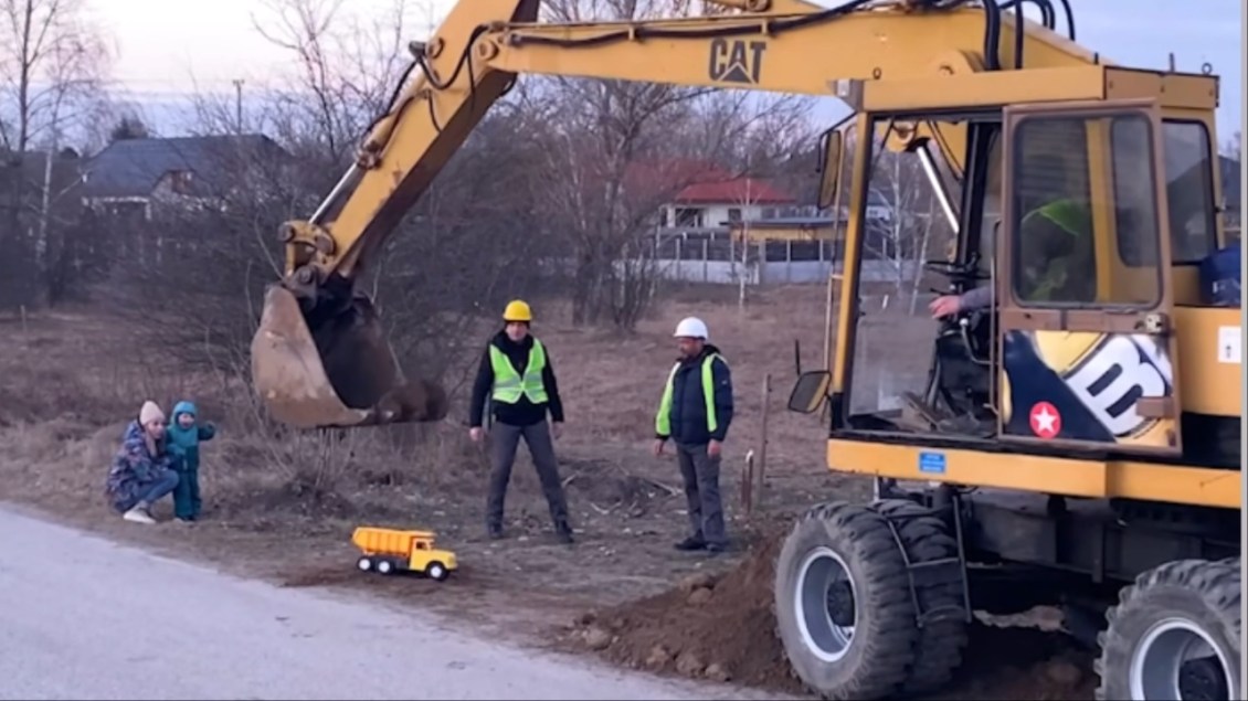 Excavator Fills Toy Dump Truck