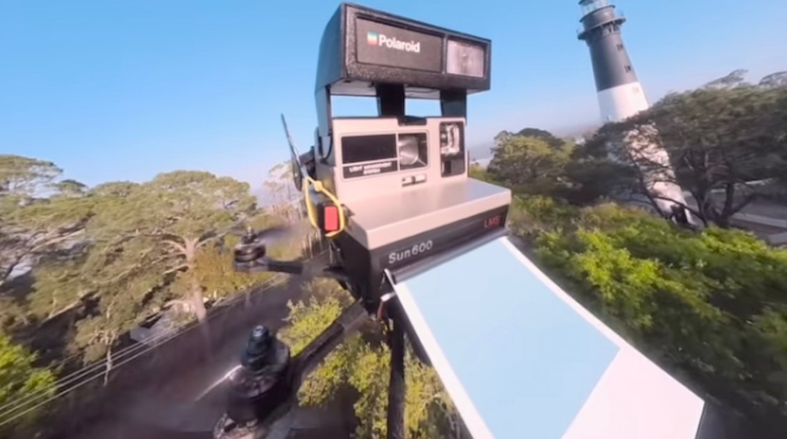 A 1984 Polaroid Camera Takes Photos While Flying Around Mounted on a Drone