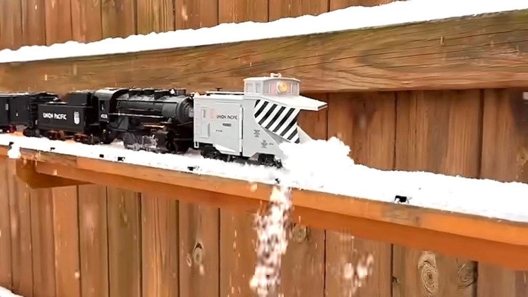 https://laughingsquid.com/wp-content/uploads/2025/01/Model Train Snow Plow