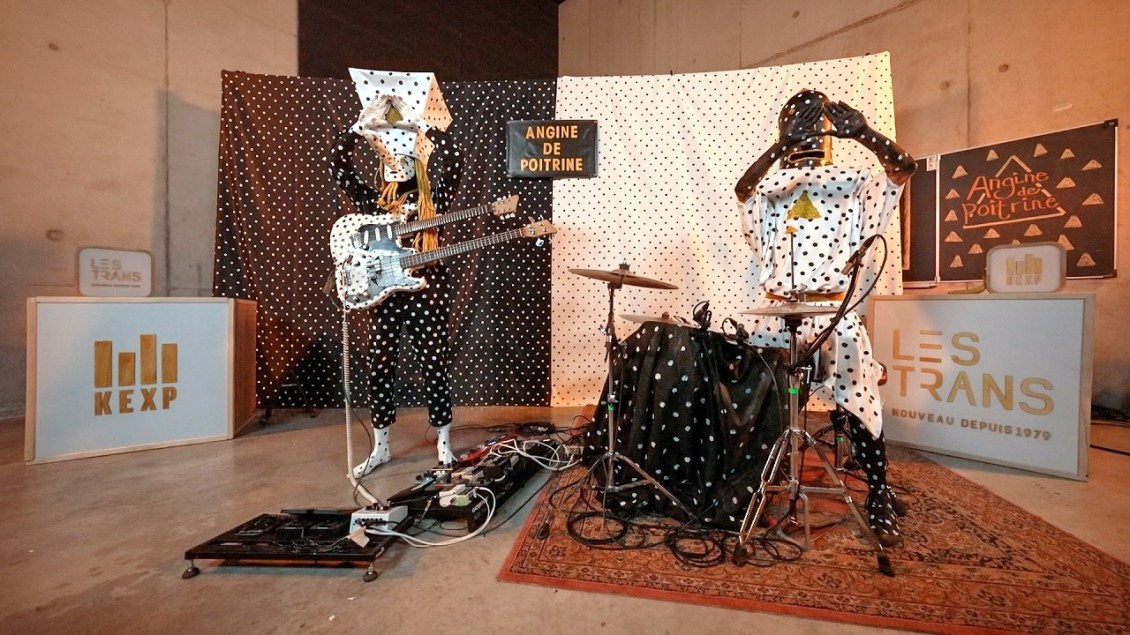 Angine de Poitrine Performs Dissonant Math Rock While Dressed in Polka Dots With Oversized Heads