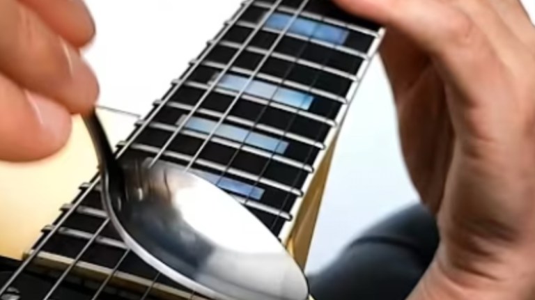 Playing Guitar With Spoon