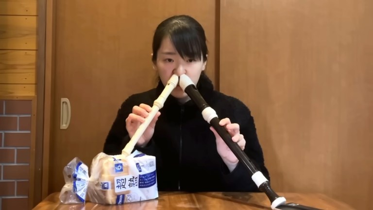 Playing Two Recorders Mouth Nose