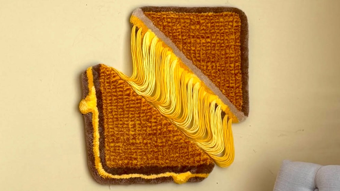 An Amazing Hand-Tufted Grilled Cheese Wall Tapestry With Stretchy Melted Cheese