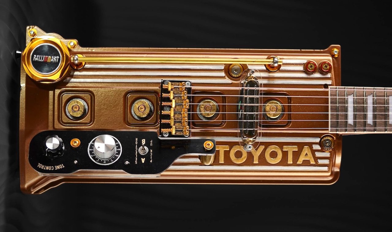 laughingsquid.com - Lori Dorn - Unique Electric Guitars Made From Discarded Car Engine Cylinder Heads