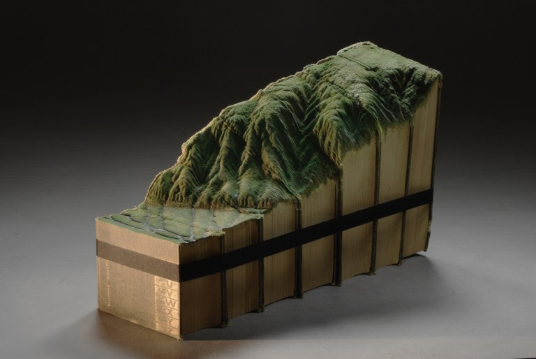 Carved book landscape sculptures by Guy Laramee