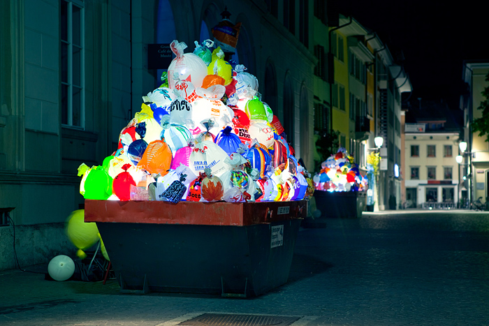 Illuminated plastic garbage by Luzinterruptus