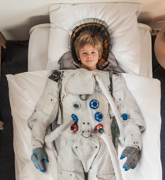 astronaut with boy inside