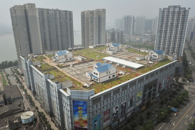 Four houses on roof of Chinese mall