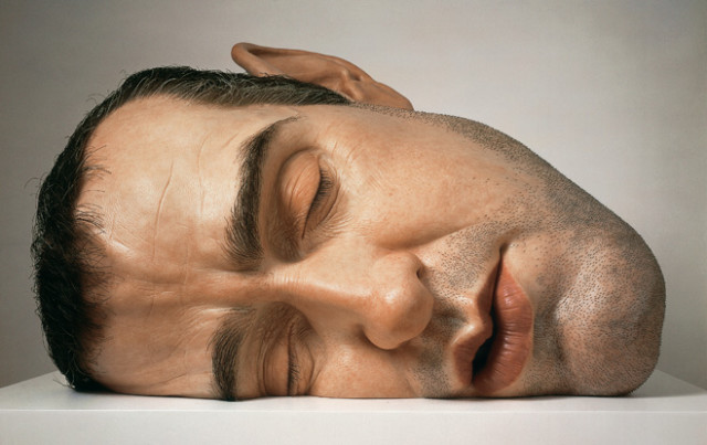 Realistic human figure sculptures by Ron Mueck