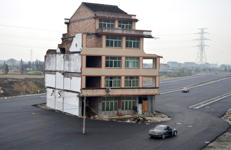 House in the middle of the road