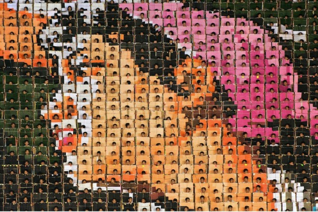 Human billboard mosaics from North Korean Mass Games by Werner Kranwetvogel