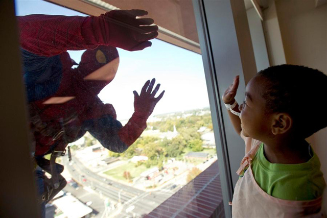 Superhero Window Washer photo by Brandon Dill / AP