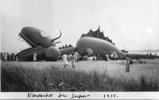 Tony Sarg's Sea Serpent balloon for the Macy's parade at rest on a Nantucket beach