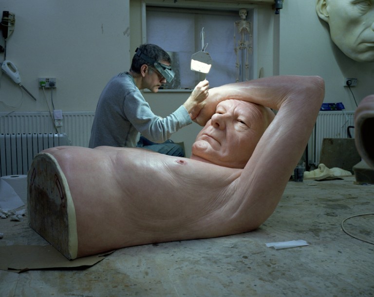 Realistic human figure sculptures by Ron Mueck